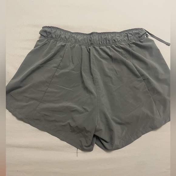 Gray Nike running shorts with attached black spandex underneath - Picture 4 of 4
